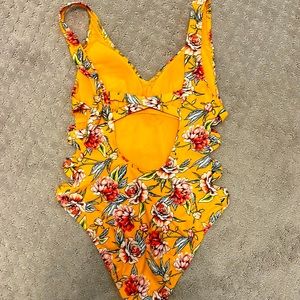 One piece floral swimsuit with cross cross cut out sides and back